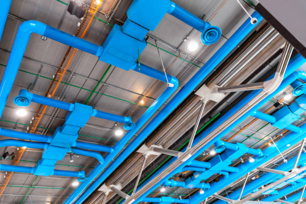 industrial building ceiling with ventilation system pipes